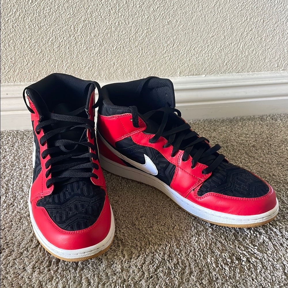 Nike Air Jordan’s Red and Black High-Top Sneakers